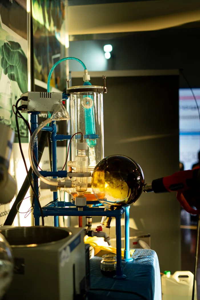 Glassware setup in a laboratory with dramatic lighting and reflections. .