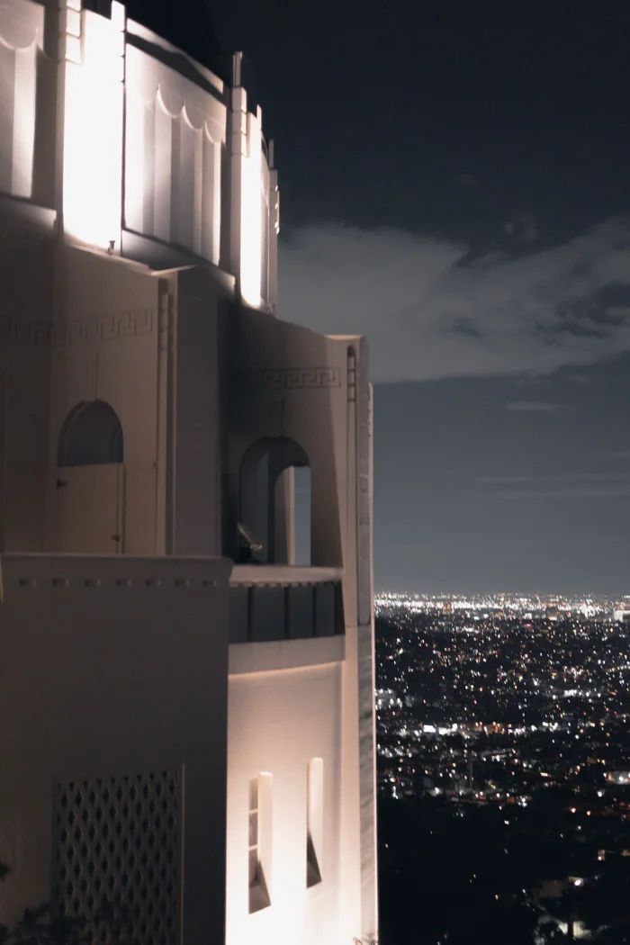 Atmospheric nighttime cityscape from Griffith Observatory overlooking Los Angeles.